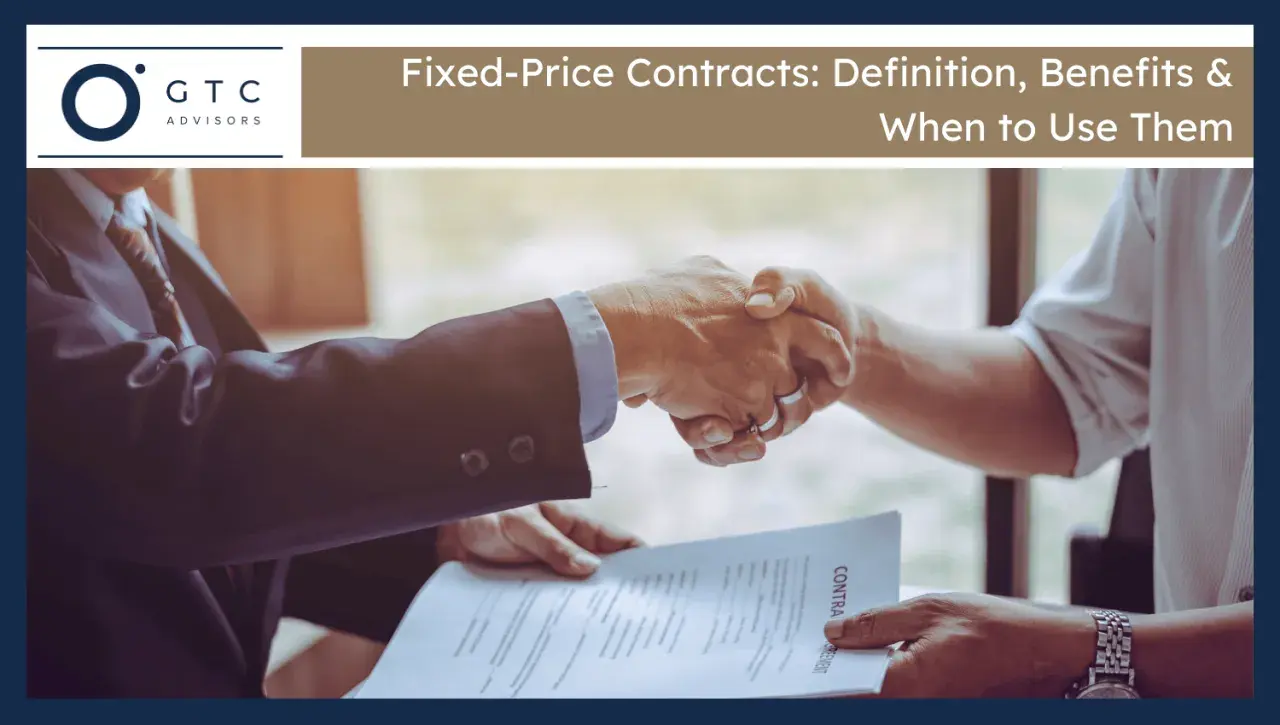 Two businessmen shake hands over a contract, signifying a firm fixed contract agreement.