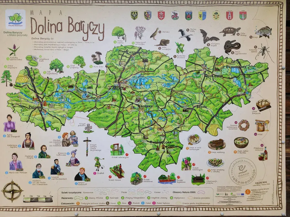 Mapa **parku krajobrazowego Dolina Baryczy** z zaznaczonymi atrakcjami, zwierzętami i roślinnością.