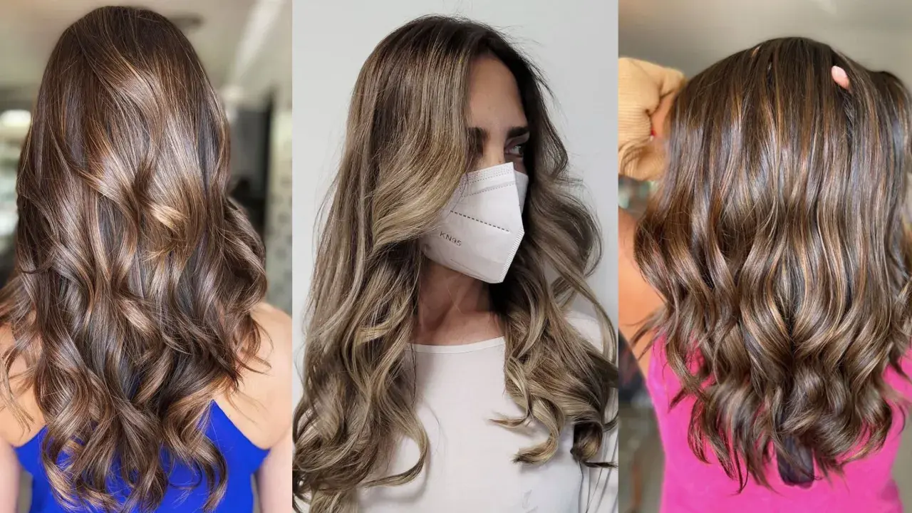 Cabello castaño con mechas mousy hair, ondas suaves y brillo natural.