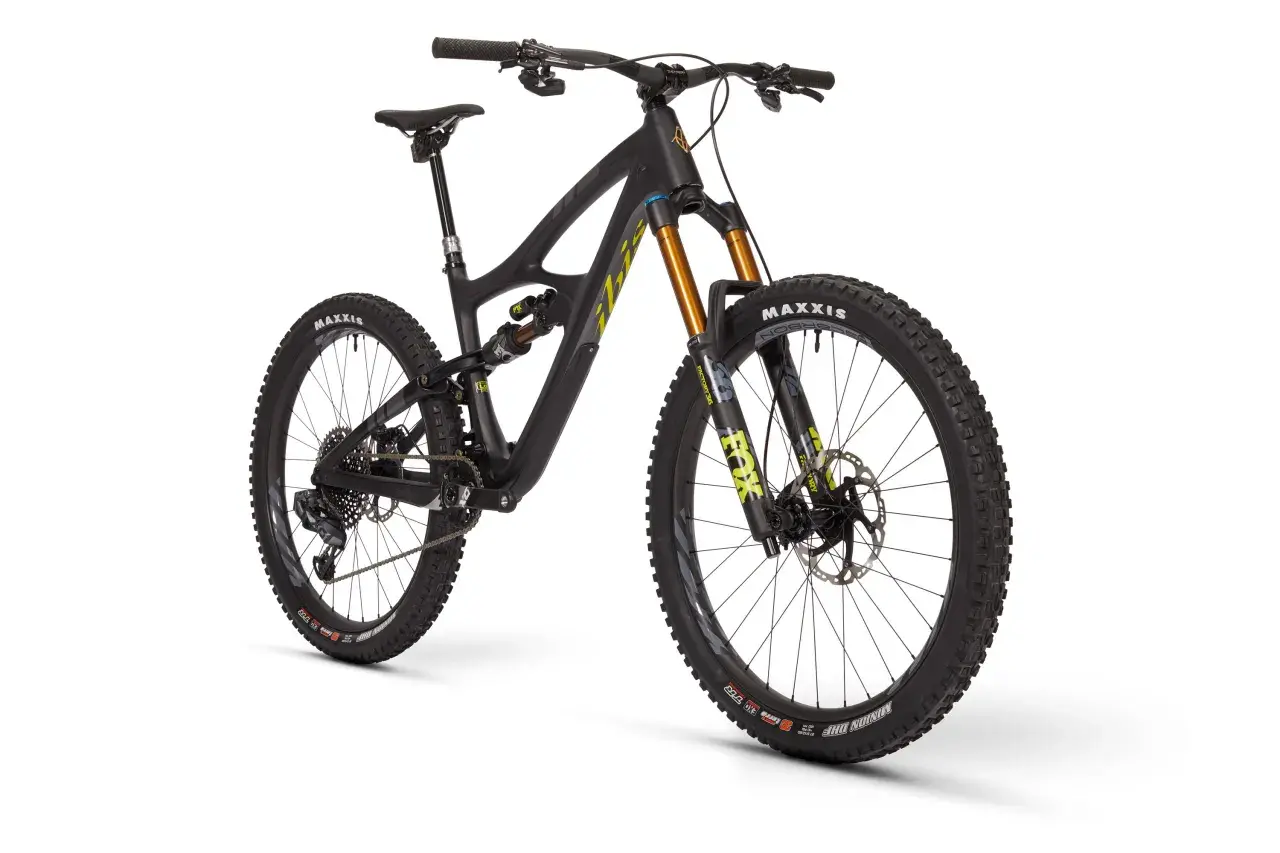 A black Ibis HD5 mountain bike with gold Fox suspension forks and Maxxis tires, ready for any trail.
