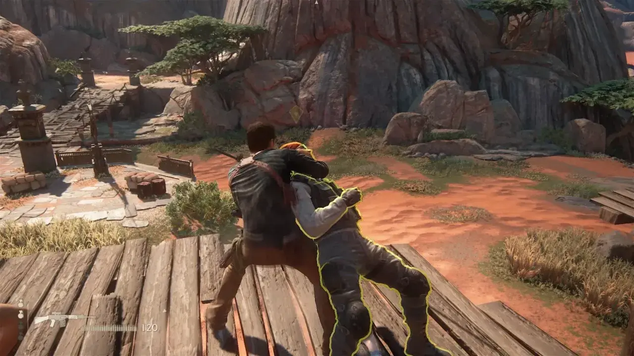 Nathan Drake walczy z przeciwnikiem na drewnianej platformie. Scena z jednej z najlepszych gier na PS4.