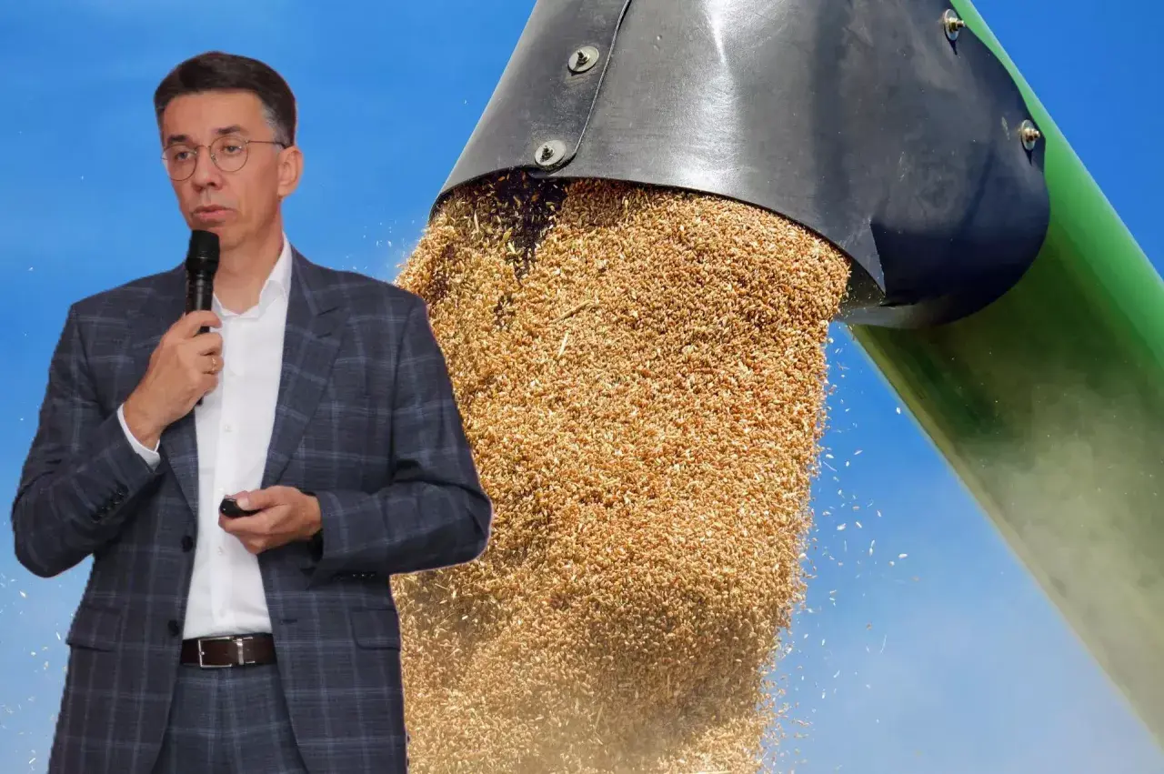 Mężczyzna w garniturze przemawia na tle strumienia zbóż. Dyskusja o cenach zbóż.