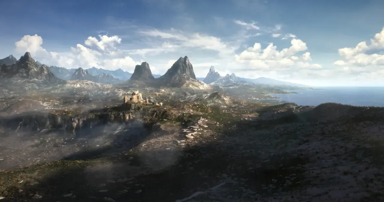 Krajobraz z gry The Elder Scrolls 6: górzysty teren z zamkiem na klifie, morze w oddali.