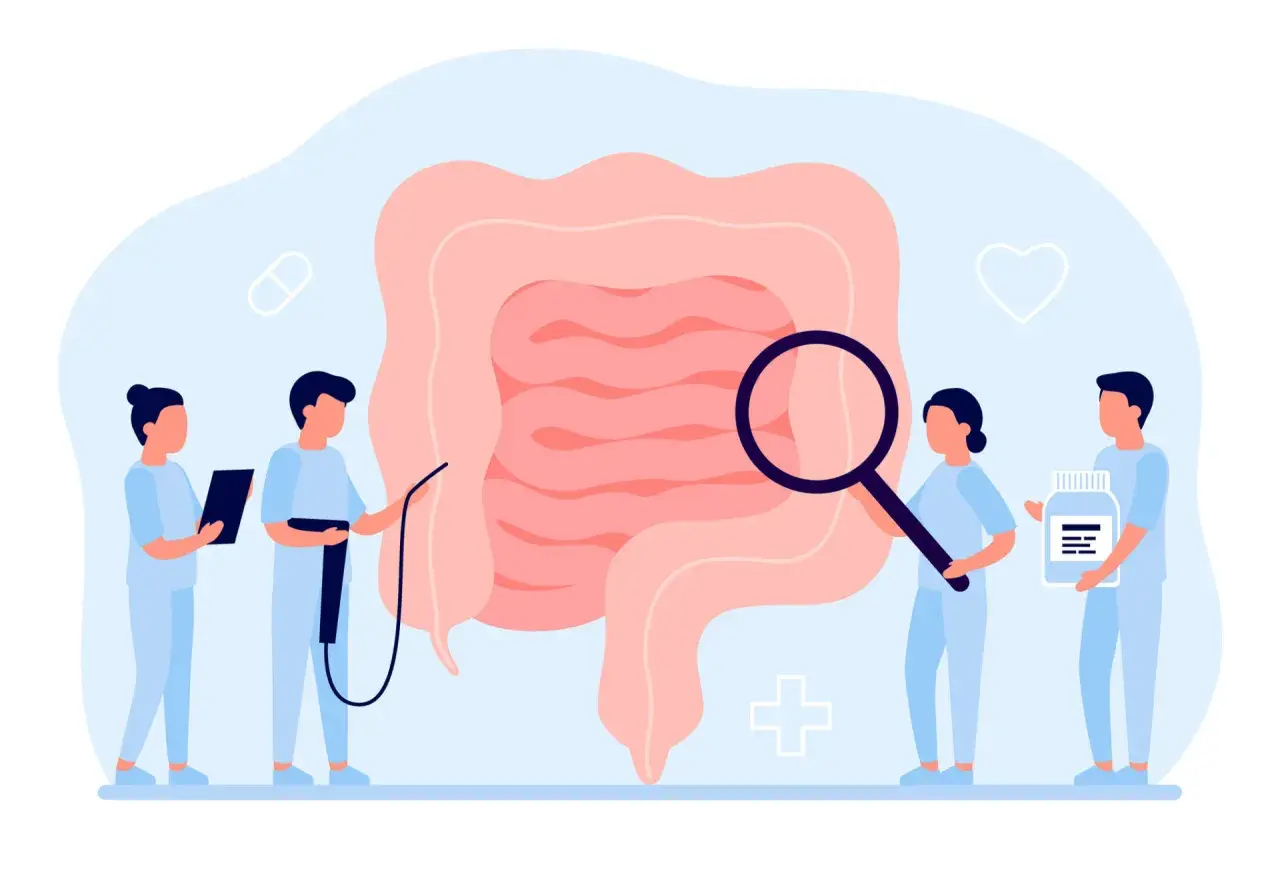 Medici esaminano un intestino ingrandito, simbolo di diagnosi e cura per la colite ulcerosa. Uno tiene una pillola, un altro una bottiglia di farmaci.