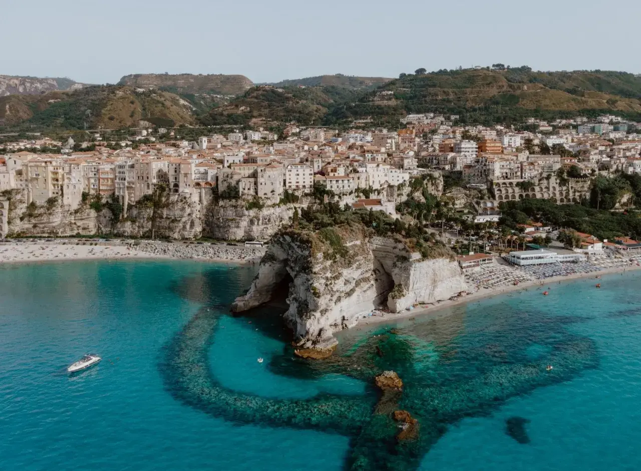 Tropea's stunning cliffs, beaches, and turquoise waters offer many things to do, from sunbathing to exploring the iconic rock formations.