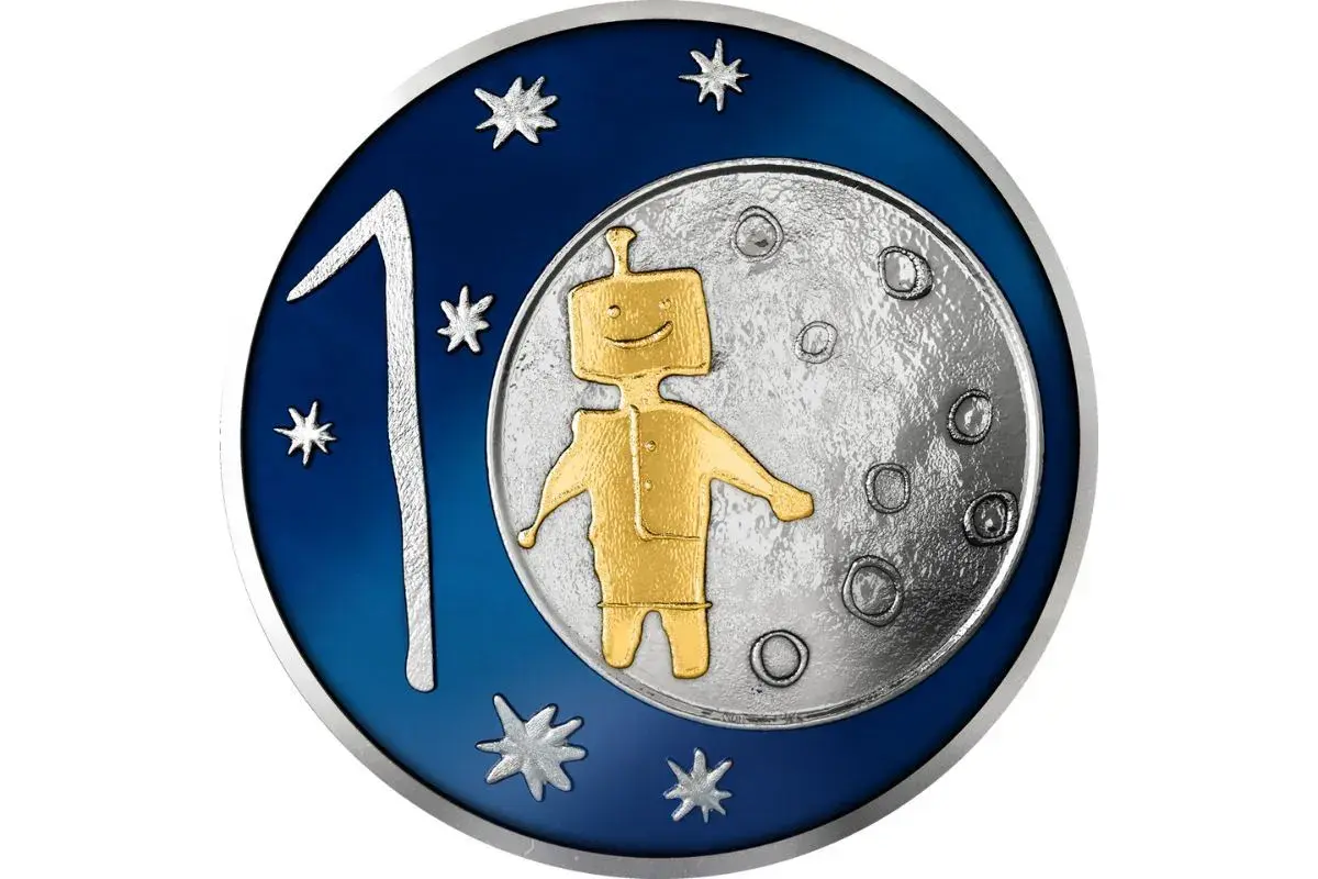 Złoty robot na Księżycu, obok cyfry 1 i gwiazdek. Taka grafika może pojawić się na monecie wyprodukowanej przez mennicę.