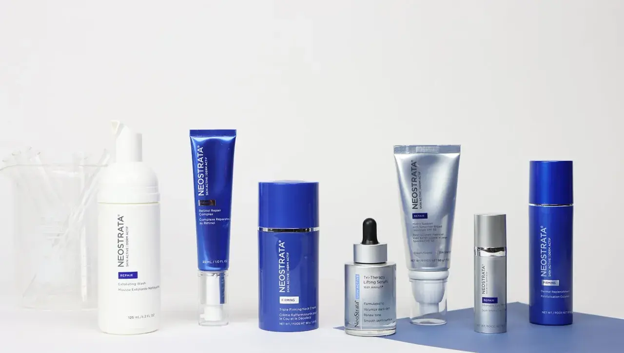 A collection of Neostrata skincare products, including serums, creams, and a wash, arranged on a white surface.