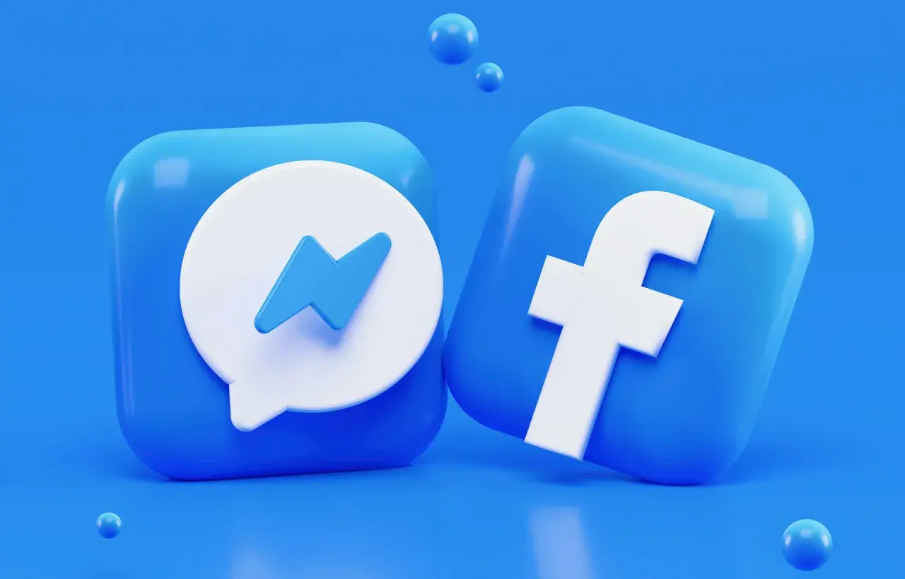 Ikony Facebook i Messenger na niebieskim tle.