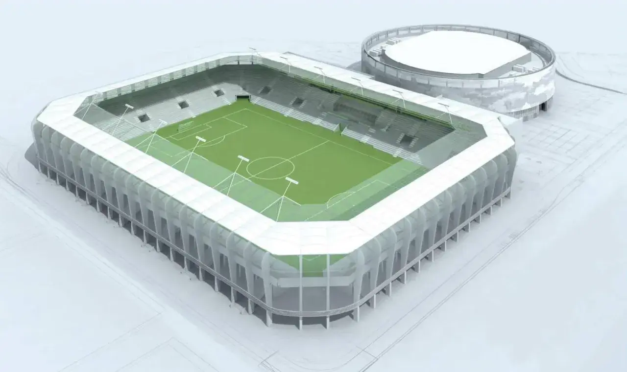 Nowoczesny stadion Radomiaka z zieloną murawą i wielopoziomowymi sektorami. Obok obiekt treningowy.
