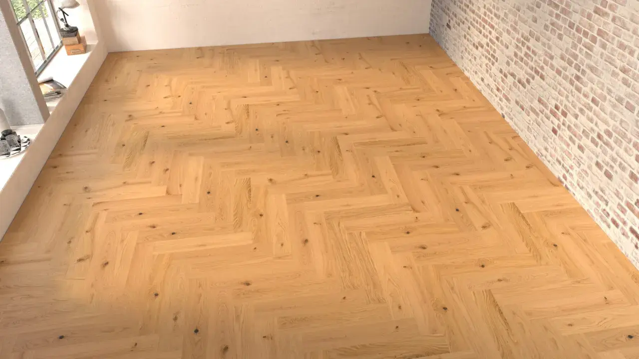 Suelo de madera con disposición en espiga, creando un patrón clásico y elegante.