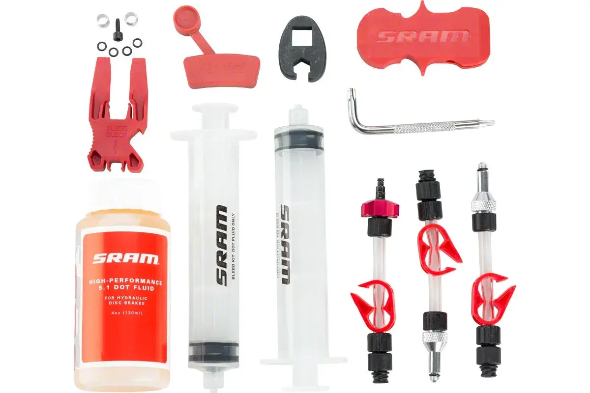 SRAM brake bleed kit with syringes, fluid, bleed block, and adapters.