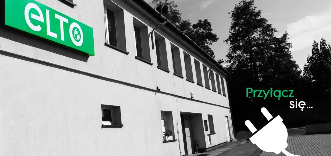 Hurtownia elektryczna ELTO zaprasza do przyłączenia się. Zielone logo ELTO na budynku i wtyczka symbolizują energię.