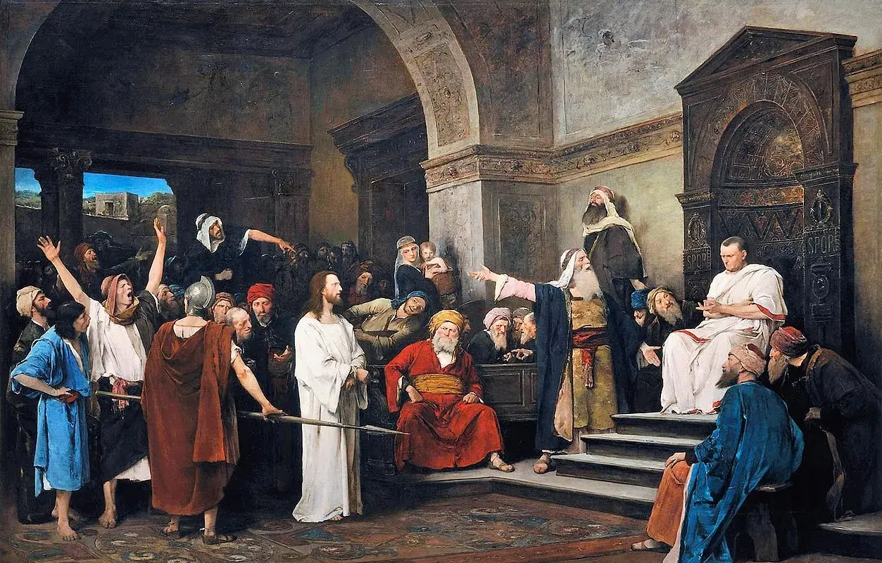 Piłat, pytany kto skazał Jezusa na śmierć, wskazuje na tłum. Jezus stoi po lewej.