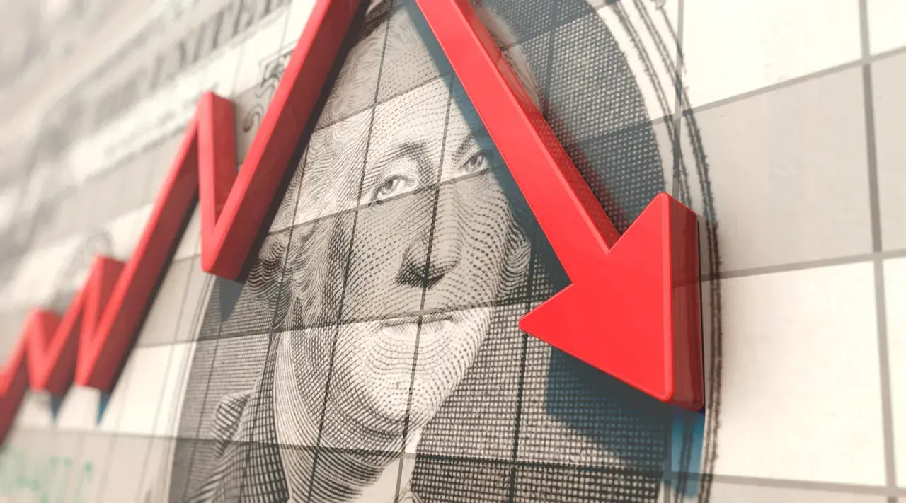 Roter Pfeil zeigt nach unten über ein US-Dollar-Schein, der den MSCI USA repräsentiert.
