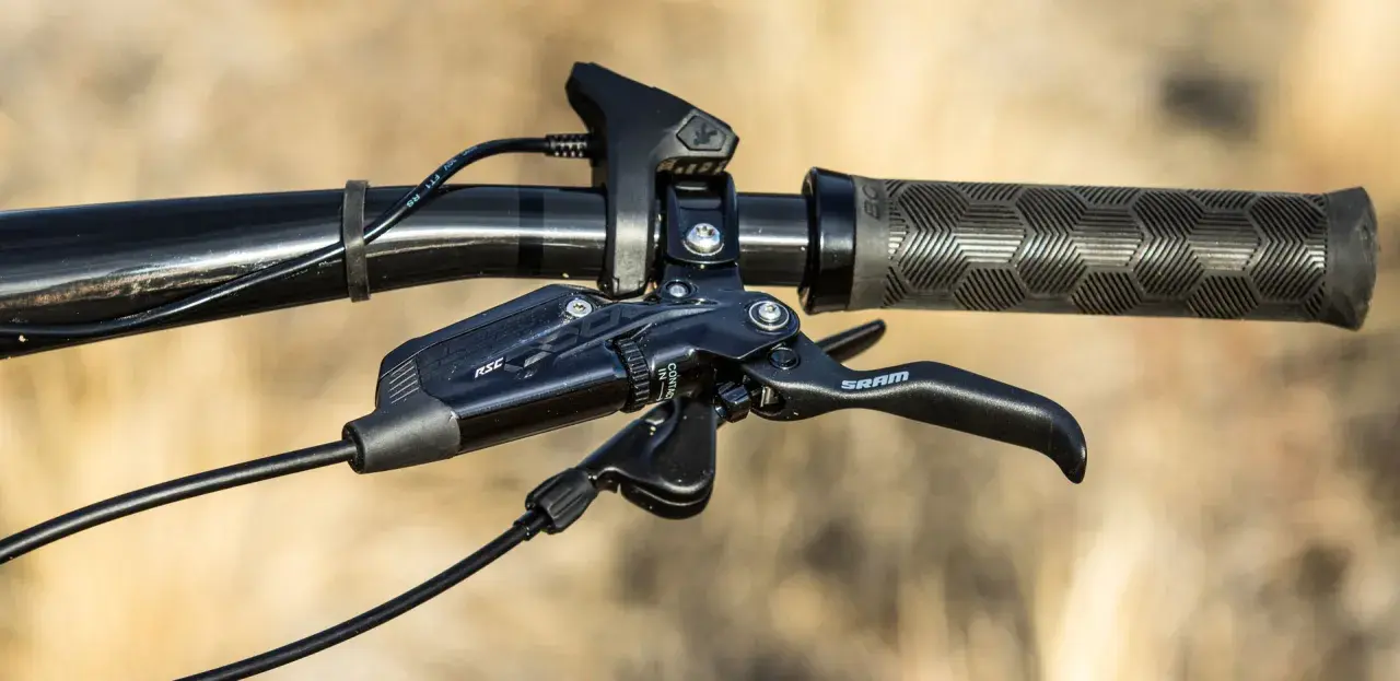 Close-up of a SRAM brake lever with RSC branding, ready for the next trail ride.