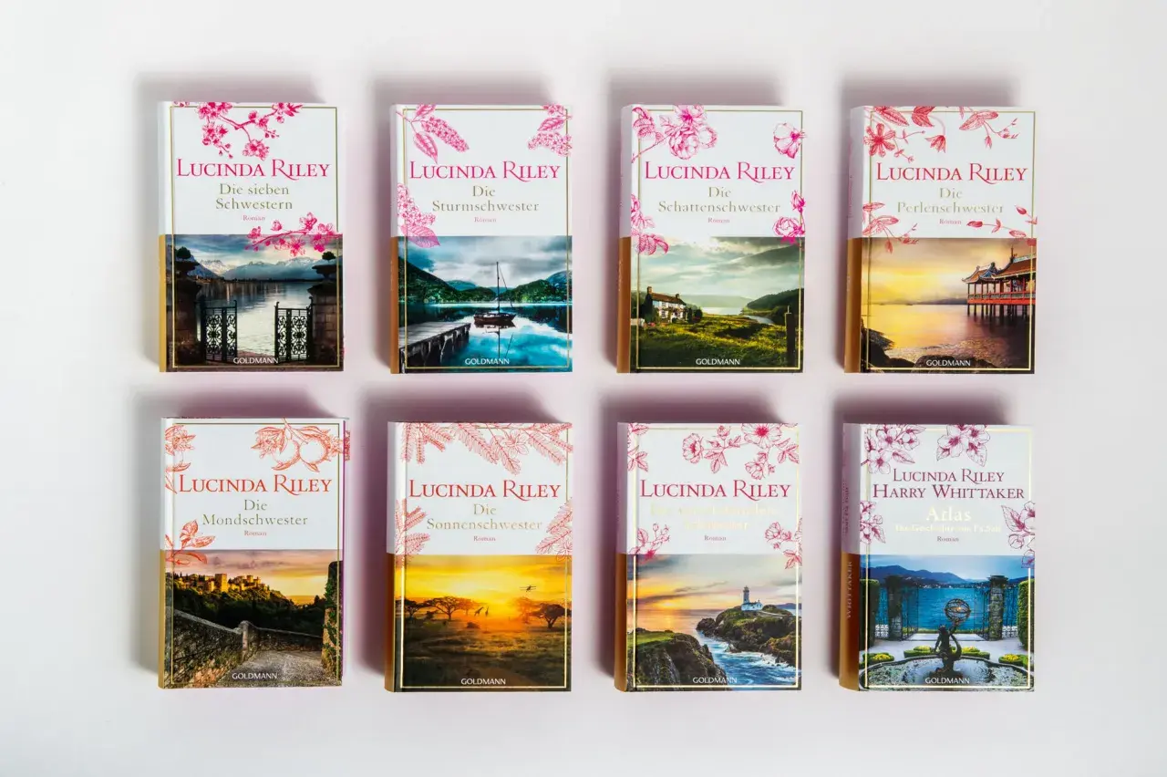 A collection of Lucinda Riley's "Die sieben Schwestern" book series, each with unique cover art depicting scenic landscapes.