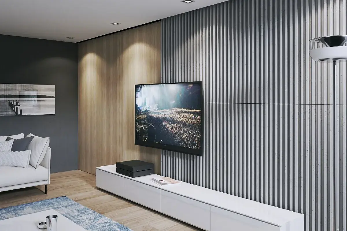 Nowoczesna ściana TV: beton i lamele tworzą stylowe tło dla ekranu. Drewniane panele dodają ciepła.