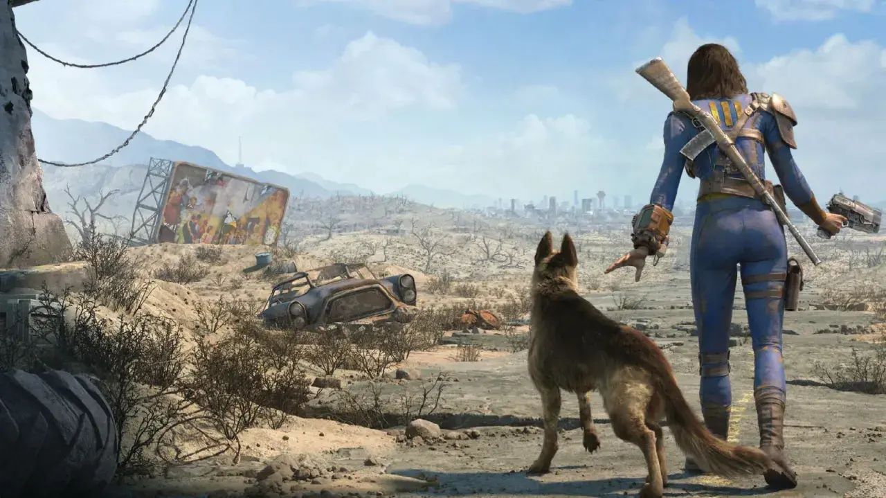 Eine Frau im blauen Schutzanzug und ihr Hund blicken auf eine zerstörte Stadt. Ein Testbild für Fallout 4.