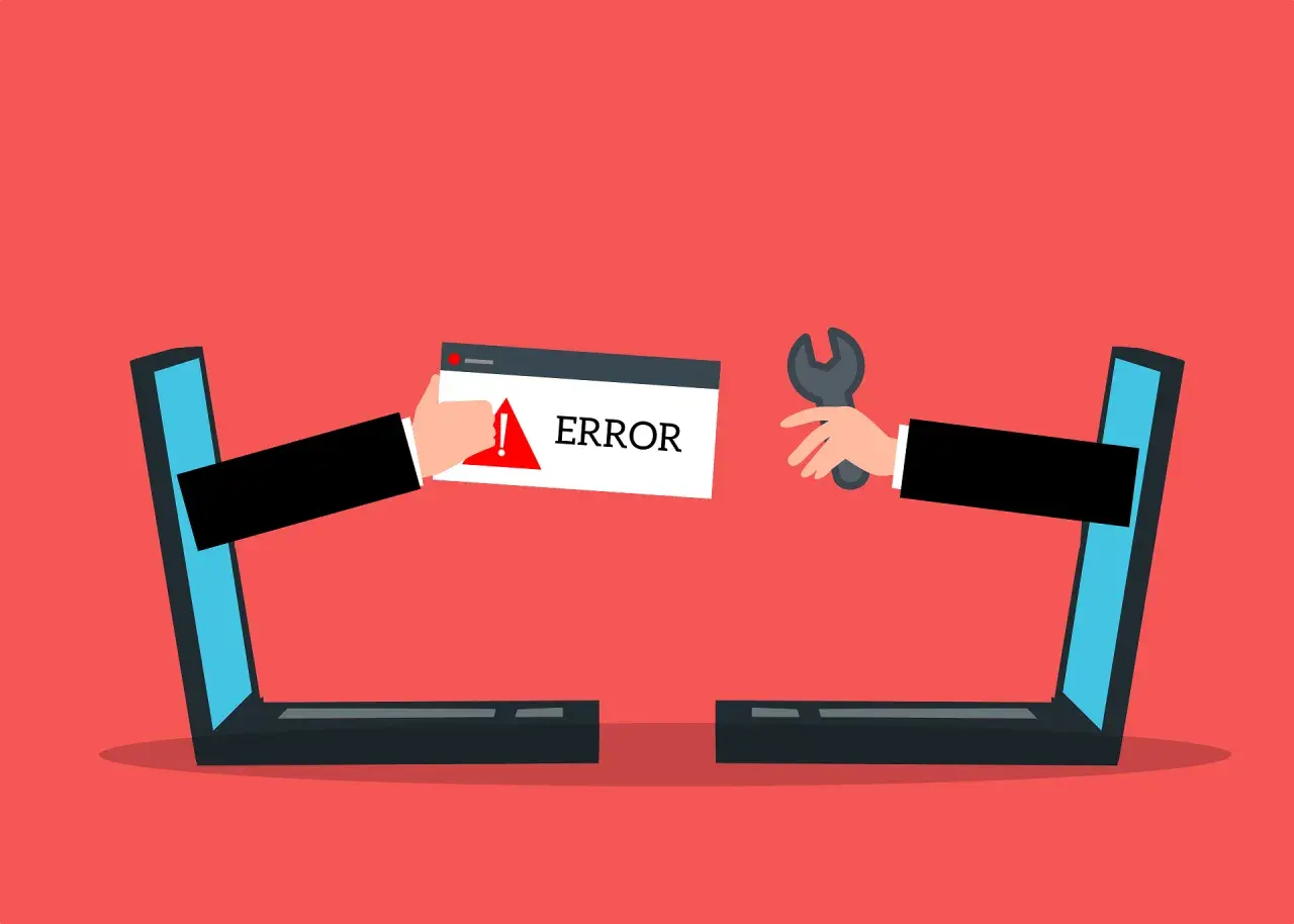 Dwie ręce wychodzące z laptopów. Jedna trzyma komunikat "ERROR", druga klucz francuski. Strona w przebudowie.
