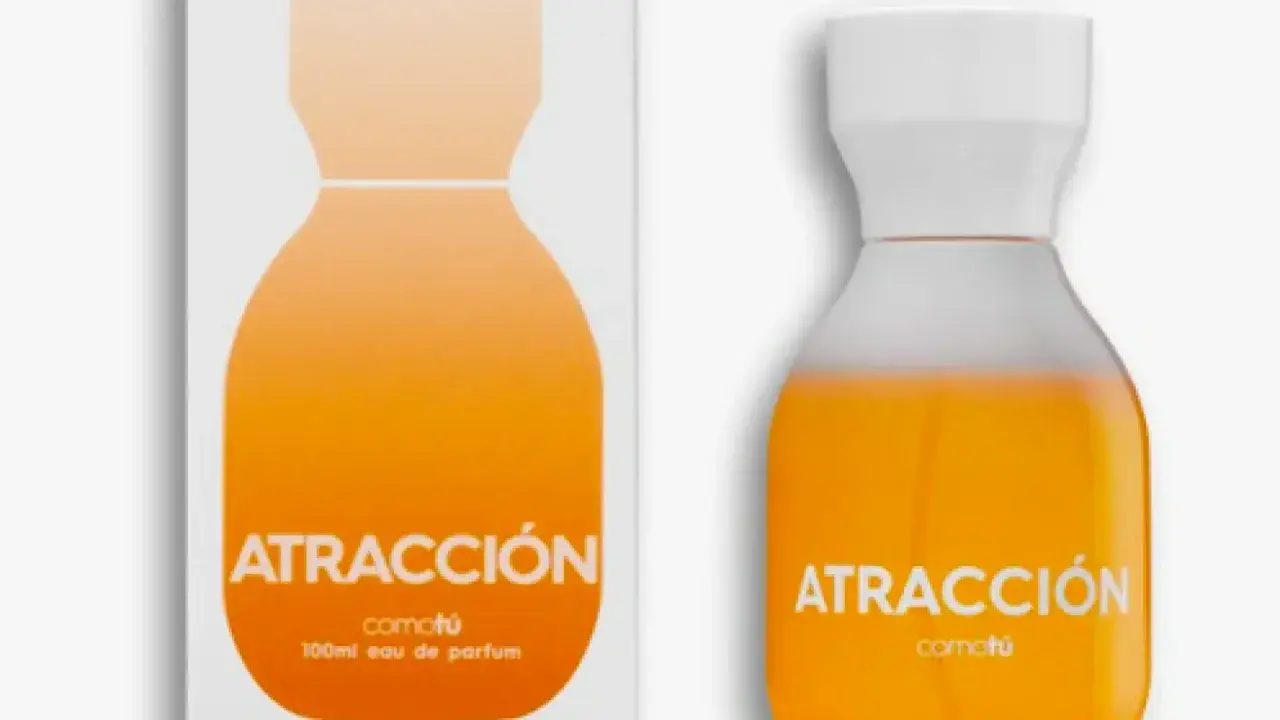 Perfume "Atracción" de Comotú, un eau de parfum para ella de Mercadona, con un diseño naranja vibrante.