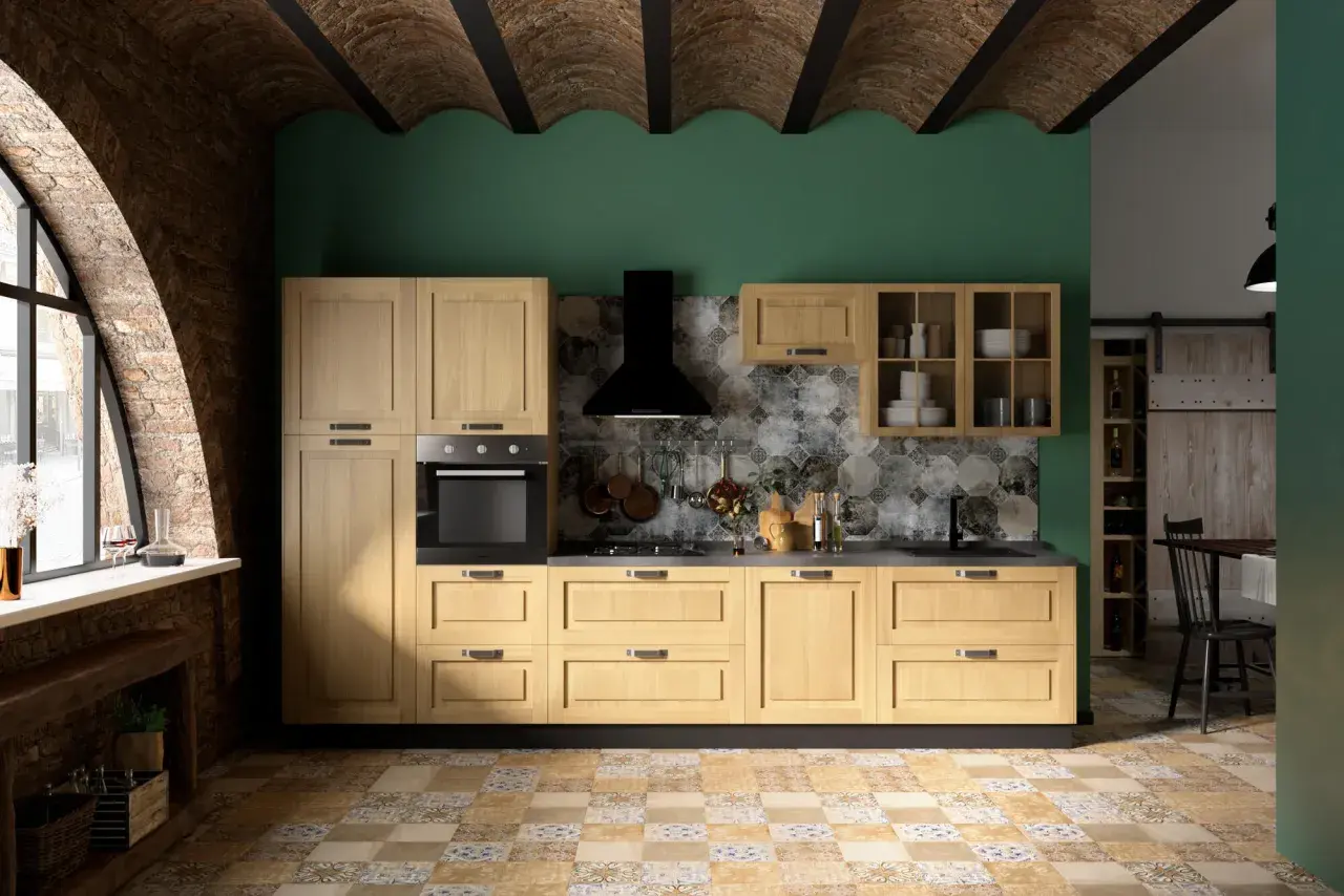 Cucina moderna con mobili in legno chiaro, parete verde smeraldo e soffitto a volta in mattoni. Ottime idee pittura cucina per un look rustico e contemporaneo.