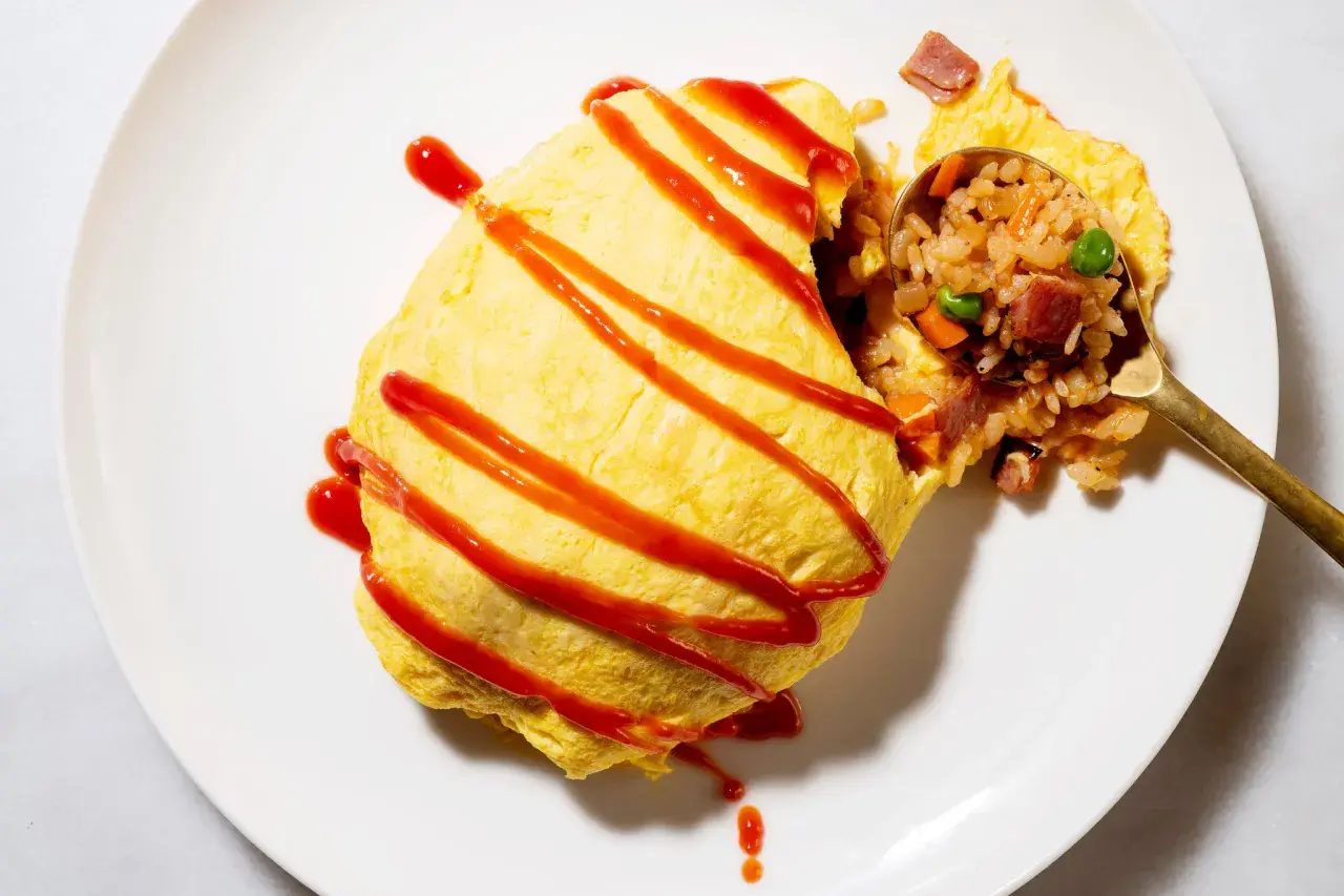 A delicious omurice, drizzled with ketchup. This dish is a popular choice for those curious about omurice calories, offering a satisfying meal.
