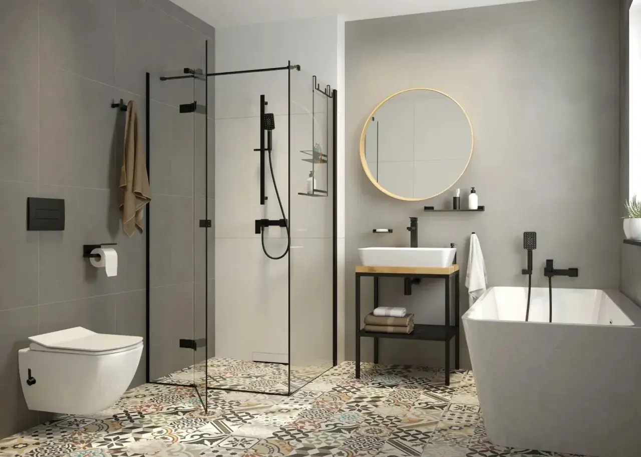 Nowoczesna łazienka z wanną, prysznicem i umywalką. Zastanawiasz się, bidet co to? To urządzenie do higieny intymnej, które może być osobnym elementem lub funkcją toalety.