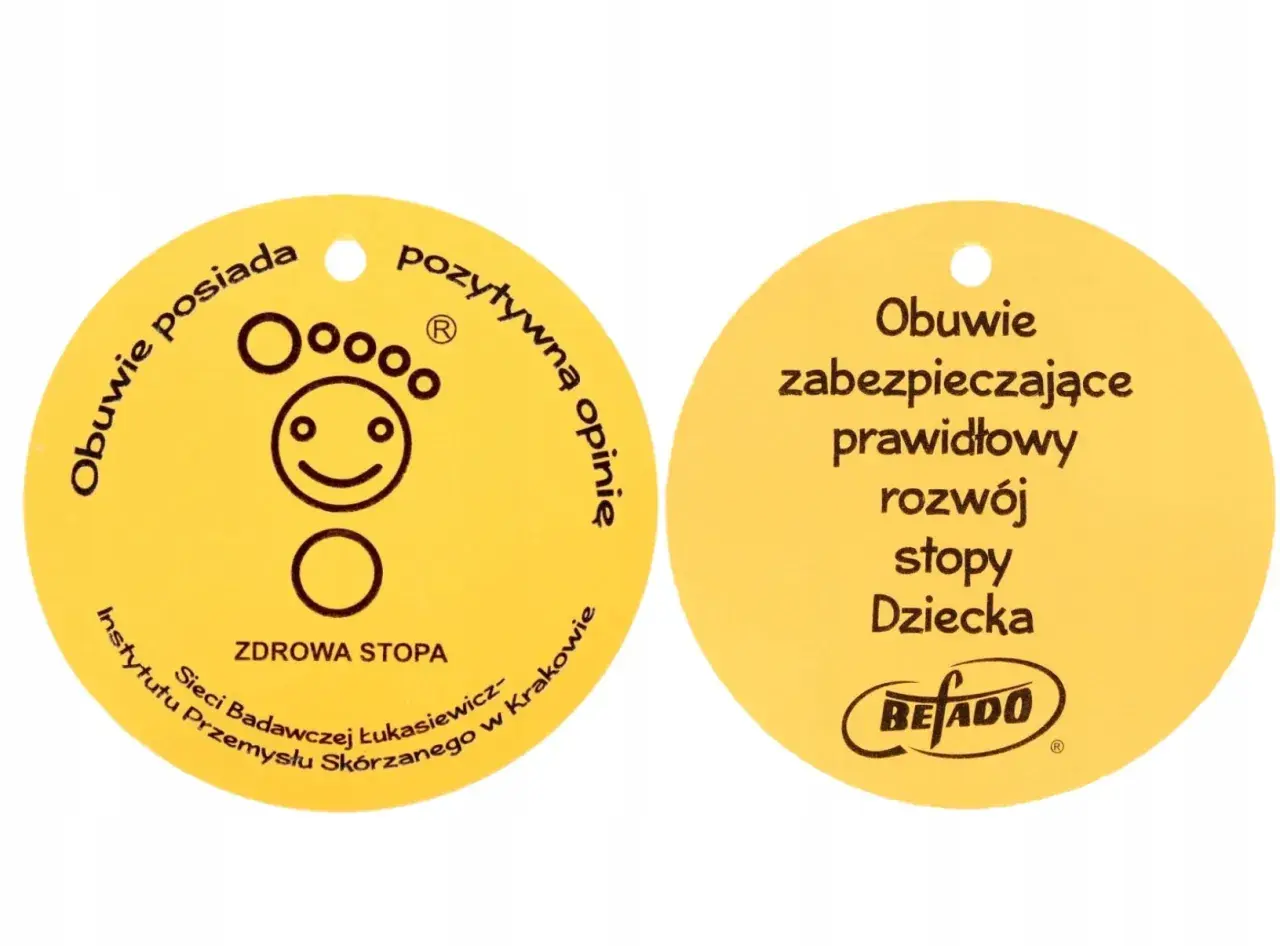 Żółty certyfikat "Zdrowa Stopa" z symbolem uśmiechniętej stopy i napisem "Obuwie zabezpieczające prawidłowy rozwój stopy Dziecka".