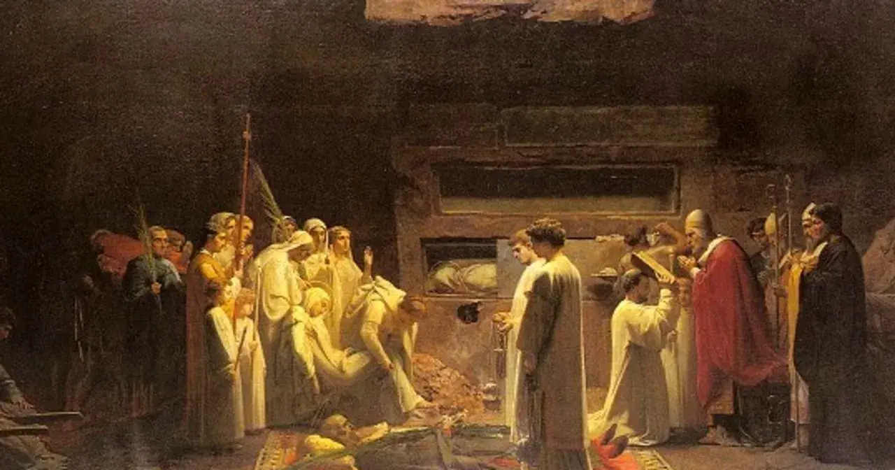 Scena religijna, gdzie wierni modlą się przy grobie. Czy można prosić zmarłego o pomoc? Obraz ukazuje ludzi w białych szatach, duchownych i trumny.
