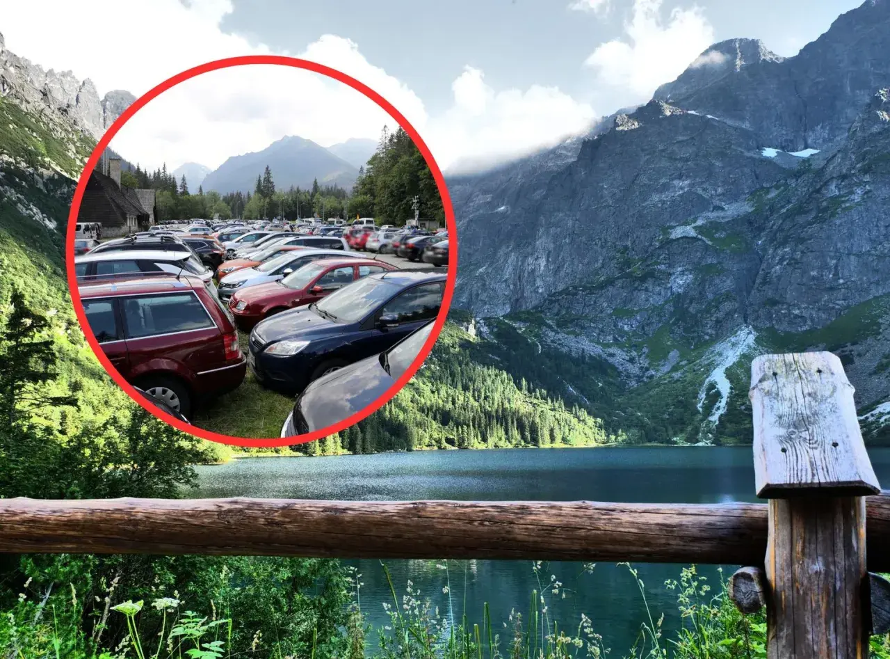 Tłok samochodów na parkingu pod Morskim Okiem. W tle piękne góry i jezioro.