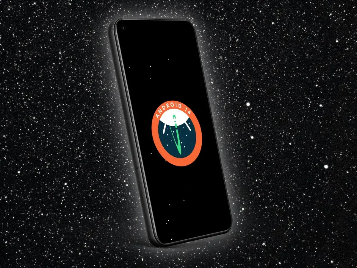 Teléfono con pantalla negra mostrando el logo de **Android 14** en un fondo estrellado.
