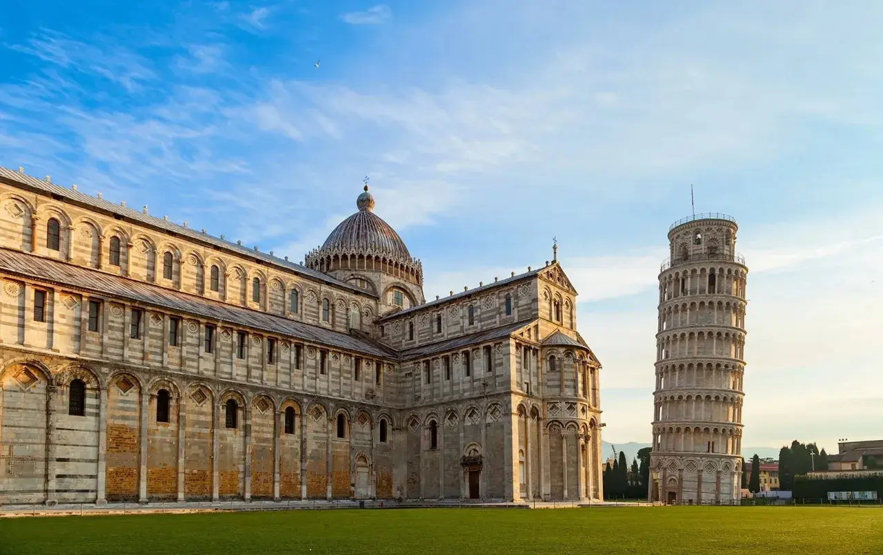 The Leaning Tower of Pisa stands proudly next to the cathedral, a must-see landmark after arriving at Pisa Airport.