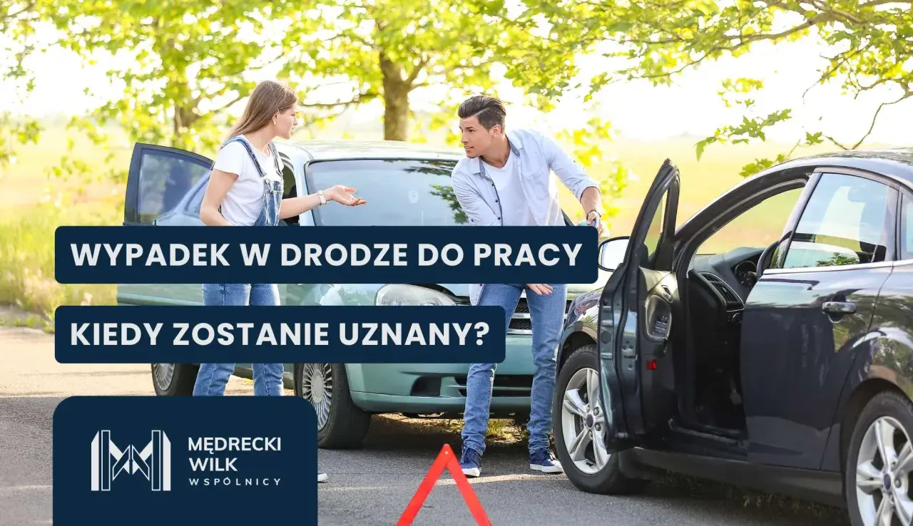 Dwie osoby rozmawiają przy uszkodzonych samochodach po wypadku drogowym.