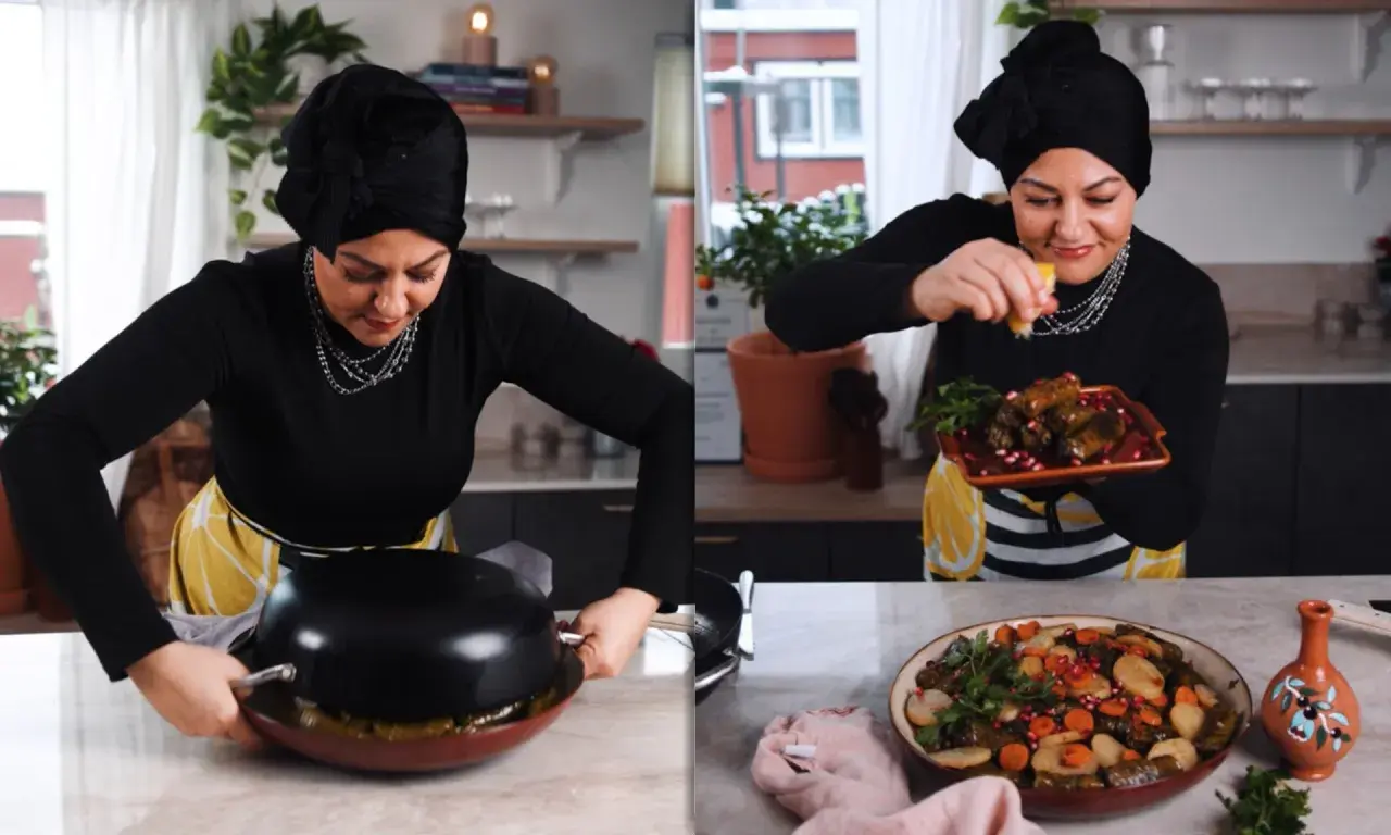 Kvinna i kök förbereder warak enab, fyllda vinblad med ris och grönsaker, och garnerar med granatäpple.