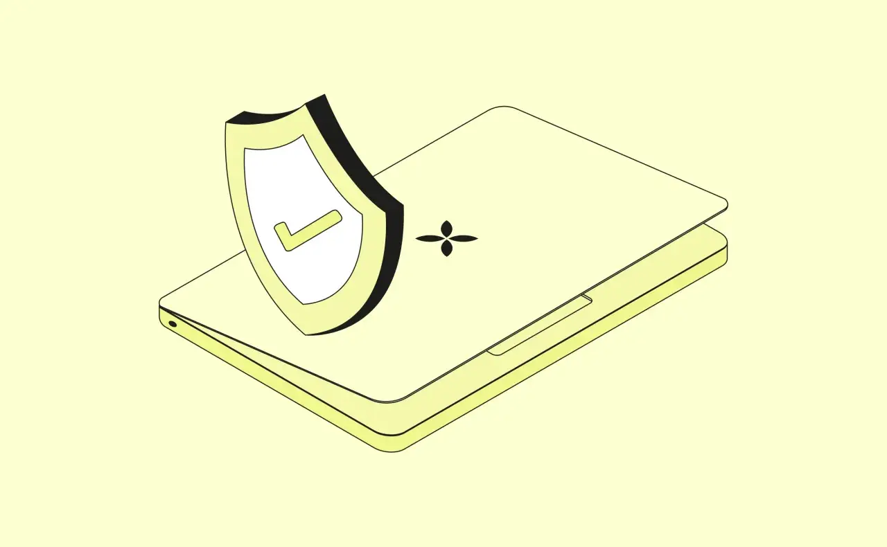 Ein Laptop mit einem Schild und einem Häkchen, das Schutz vor Internet-Betrug symbolisiert.
