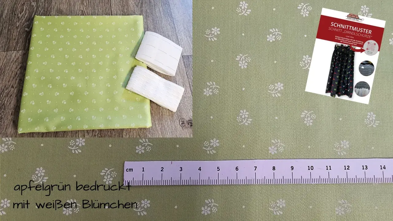 Apfelgrüner Stoff mit weißen Blümchen, ideal für eine Dirndlschürze. Ein Schnittmuster liegt bei.