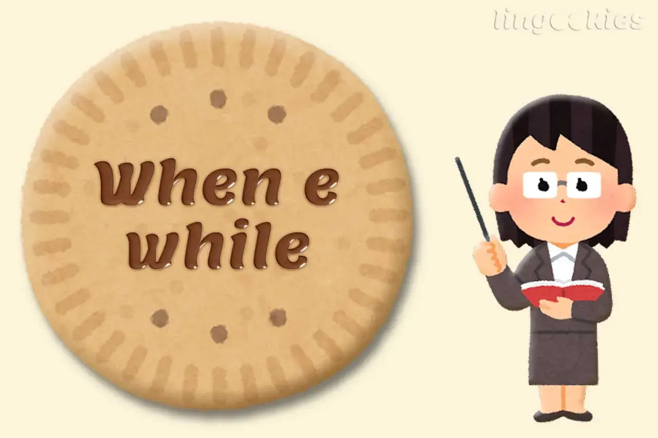 Un biscotto con scritto "when e while" accanto a un'insegnante che spiegava la grammatica inglese.