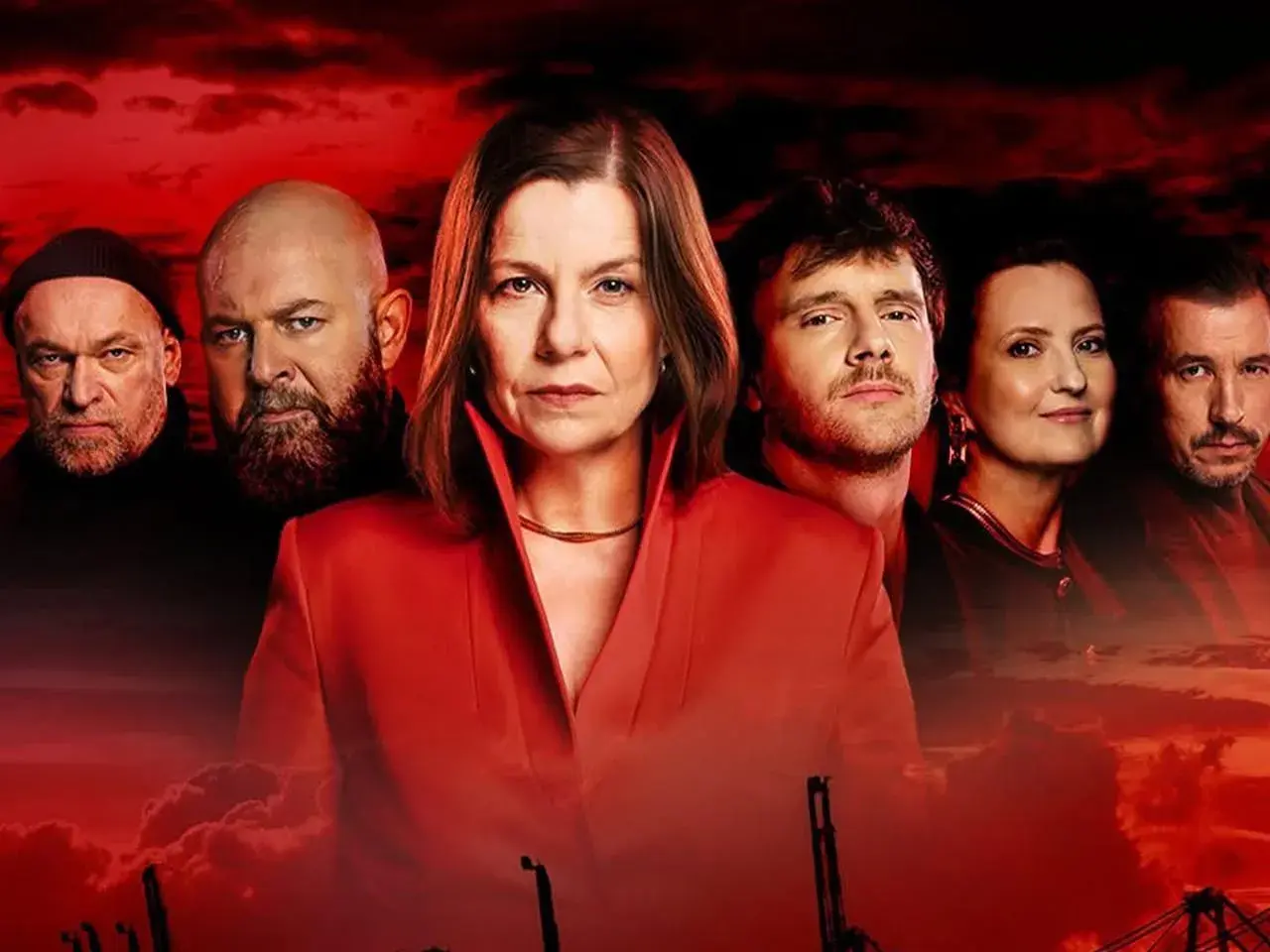 Krew z krwi: czy będzie 4 sezon? Obsada serialu w dramatycznym ujęciu na tle czerwonego nieba.