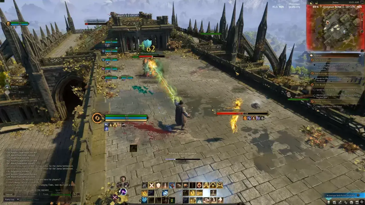 Gracze walczą z potworem w grze typu najlepsze gry mmorpg. Widać paski zdrowia, umiejętności i czat.