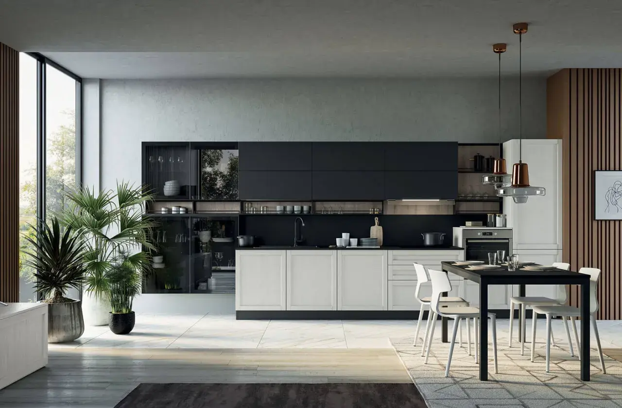 Elegante cucina laccata lucida con isola centrale, pensili neri e base bianca. Ampia vetrata e piante verdi creano un'atmosfera luminosa.