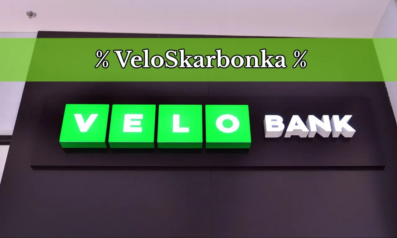 Logo VeloSkarbonka i napis BANK na ciemnym tle.