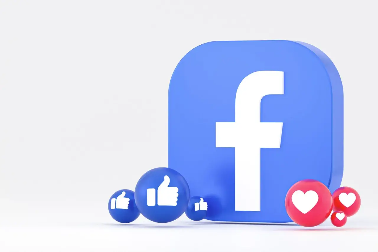 Ikona Facebooka z kciukami w górę i serduszkami. Dowiedz się, jak utworzyć wydarzenie na FB, aby promować swoje spotkania.