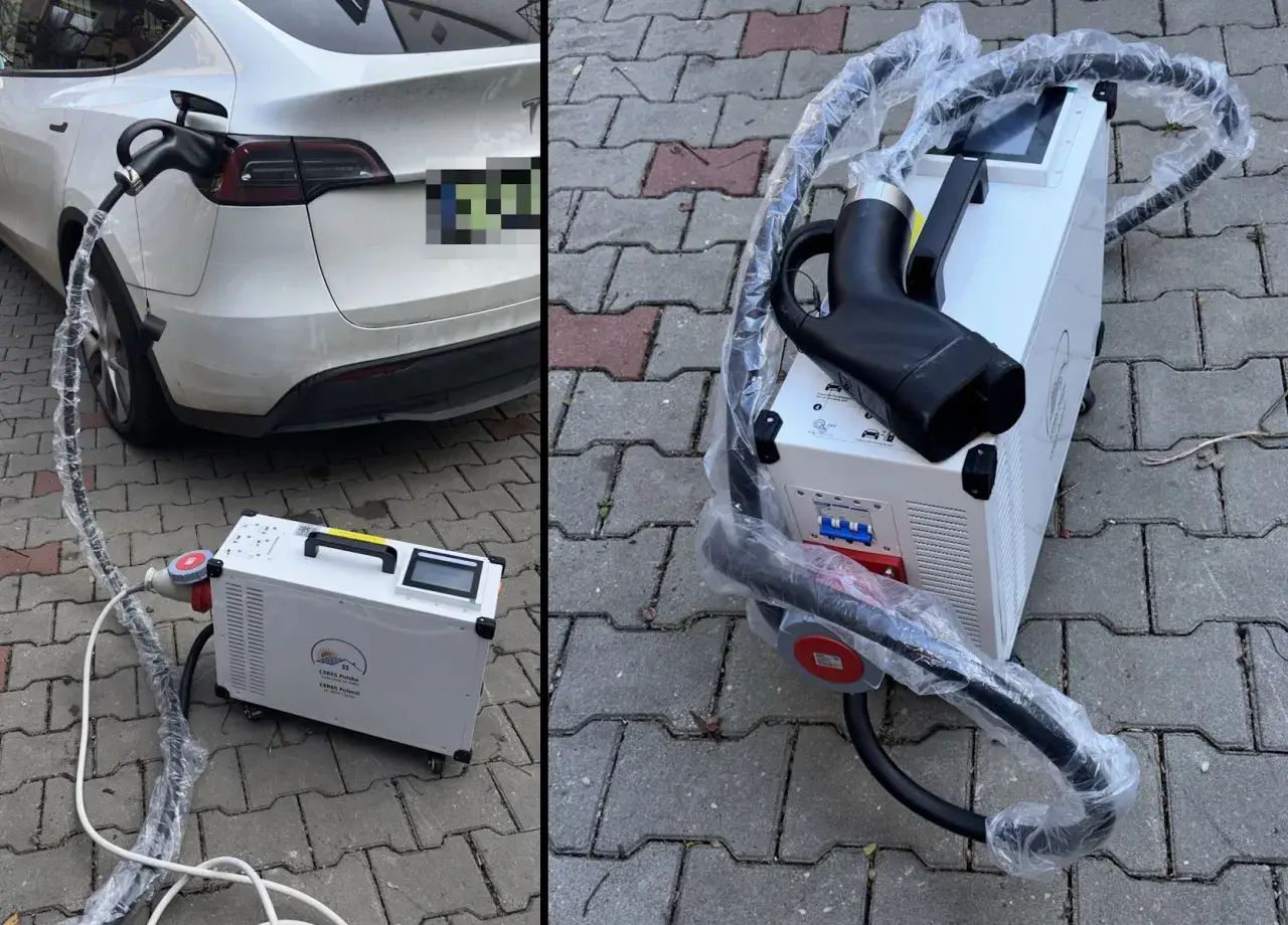 Domowa stacja ładowania samochodów elektrycznych cena. Biała Tesla podłączona do ładowarki na kostce brukowej.
