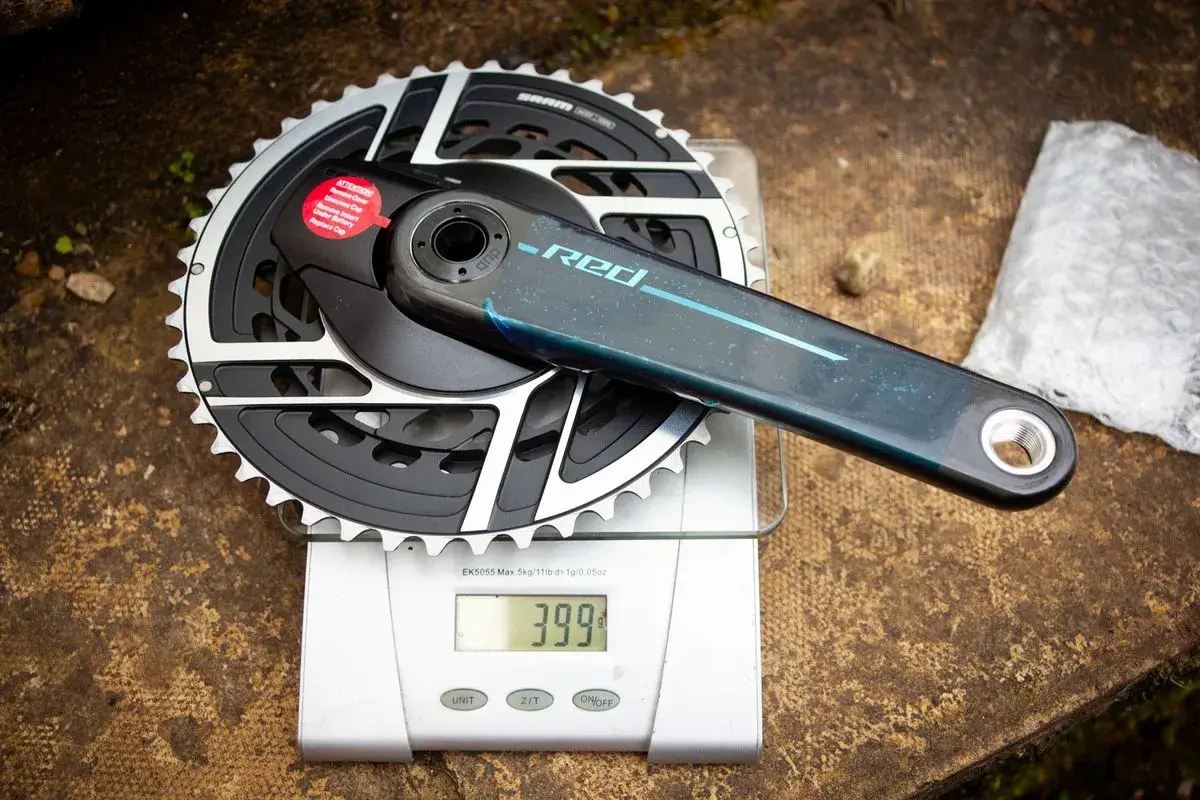 SRAM Red crankset weights 399g on a digital scale. This lightweight component is ready for performance cycling.