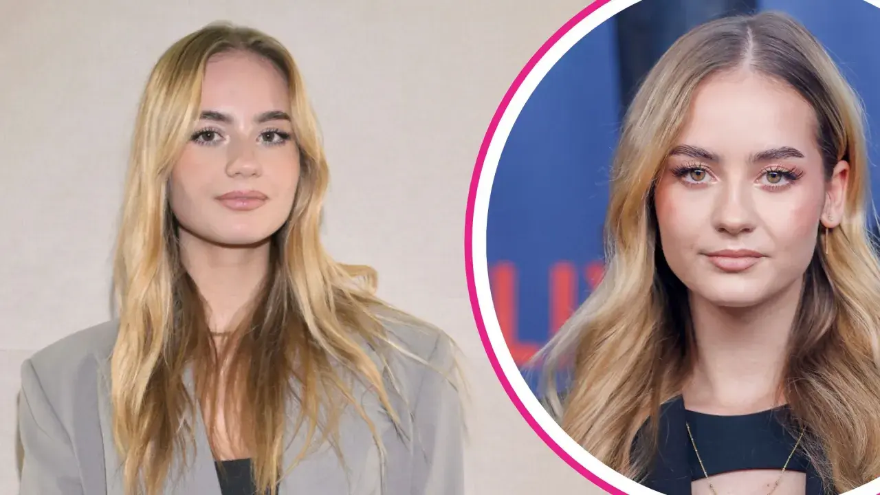 Julia Kostera, młoda influencerka, prezentuje się w eleganckim szarym żakiecie i czarnej bluzce. Jej wiek dodaje jej świeżości.