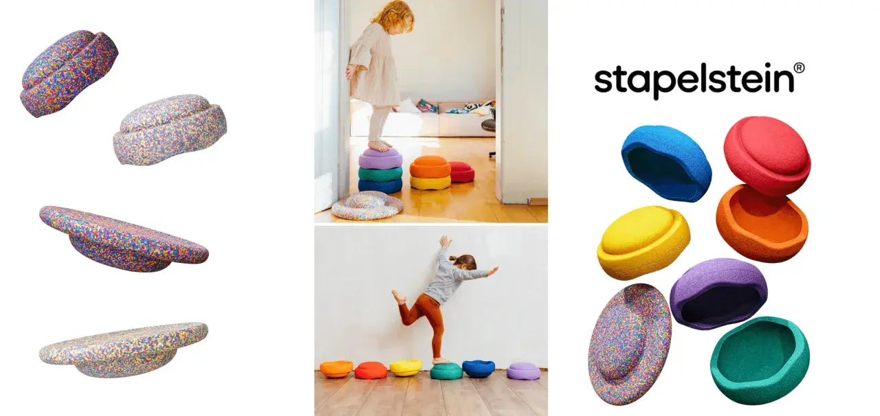 Bunte Stapelsteine regen Kinder zu kreativen Spielideen an. Kinder balancieren und stapeln die bunten Steine.