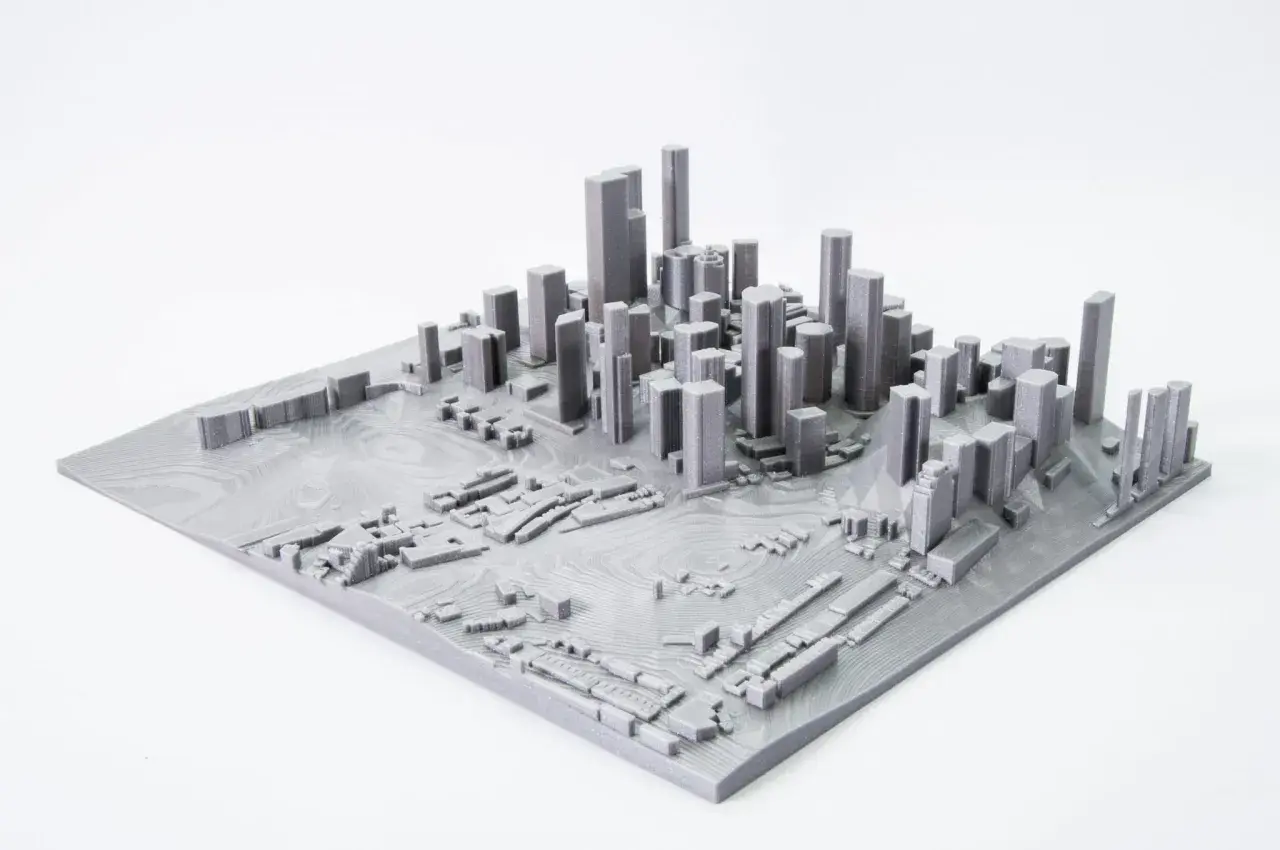 Model miasta z wieżowcami i niską zabudową, stworzony przez mapping 3d.