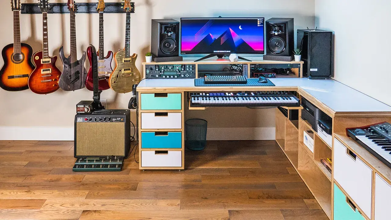 A musician's dream setup for computer music creation, featuring guitars, keyboards, speakers, and a powerful computer.