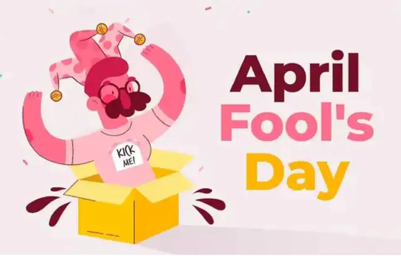 Un personaje con gorro de bufón sale de una caja amarilla, con un cartel que dice "Kick Me!". Es una ilustración de que es April Fools' Day.