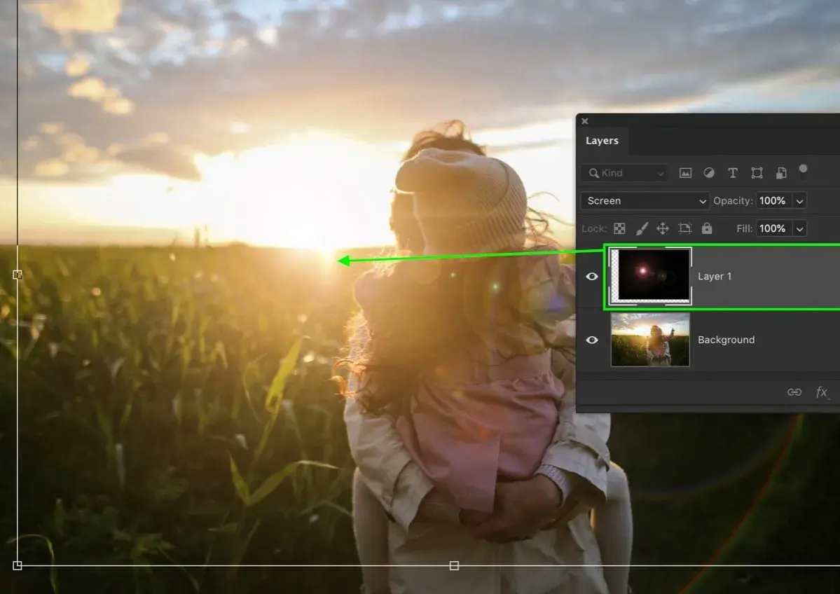 Effetto lens flare in Photoshop su un tramonto con due persone.